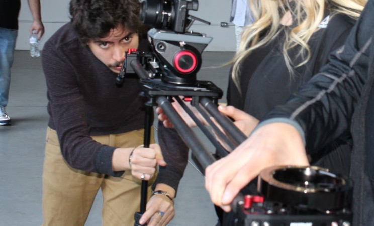 Setting up a camera rig with crew on location